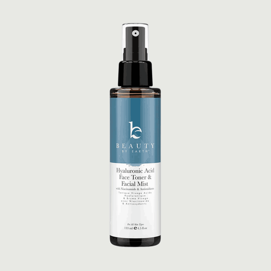 Beauty by Earth hyaluronic acid face toner and facial mist bottle on a light gray background