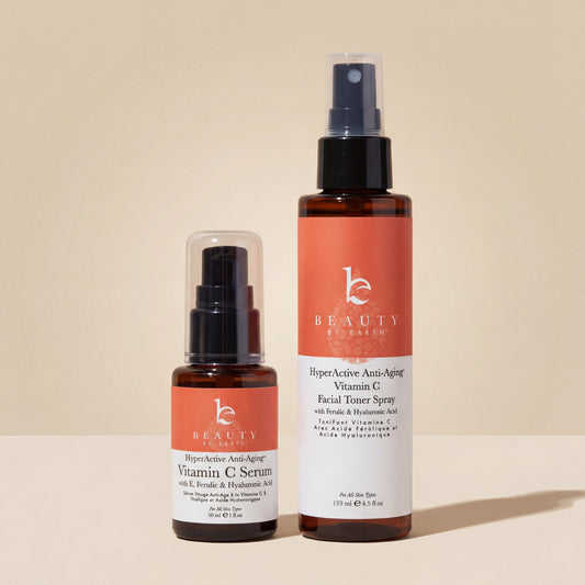 Two skincare products, a serum and a facial toner spray, from Beauty by Kairo on a light gray background.