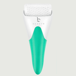 White and green roller with Beauty by Earth branding on a light gray background