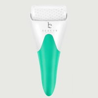 White and green roller with Beauty by Earth branding on a light gray background