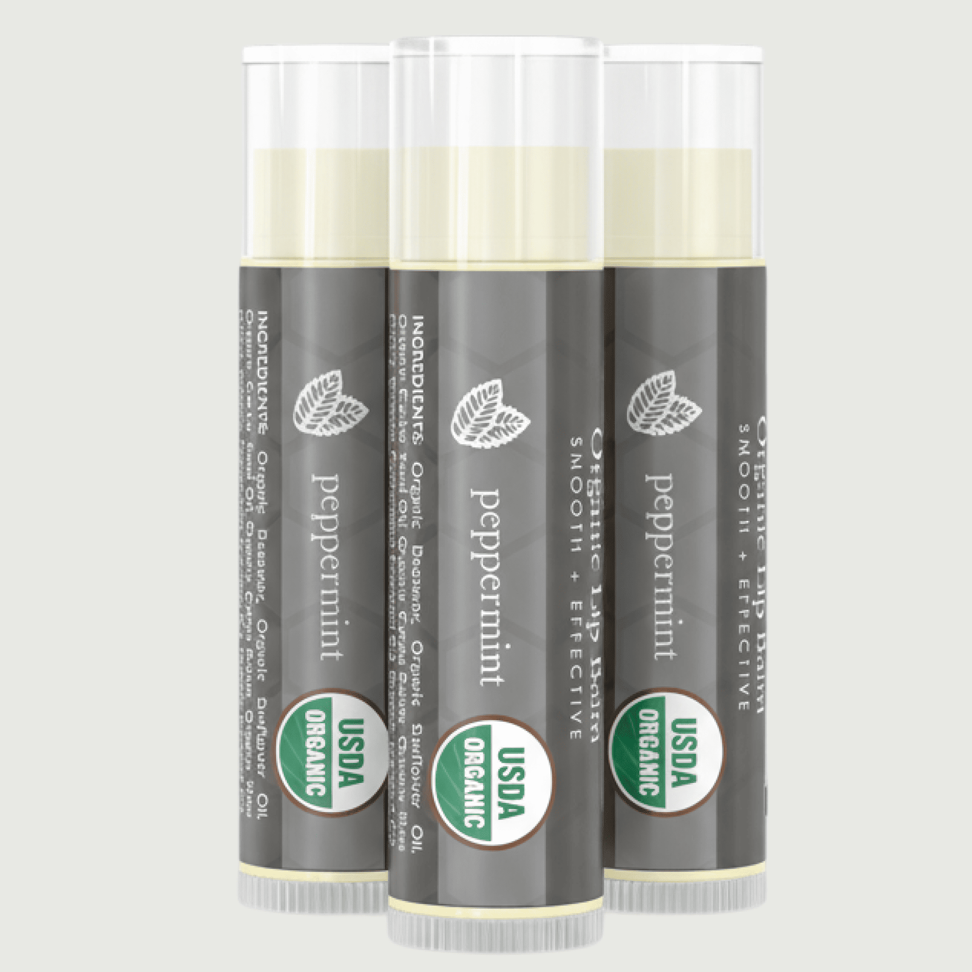 Three tubes of peppermint lip balm with USDA Organic labels on a light gray background