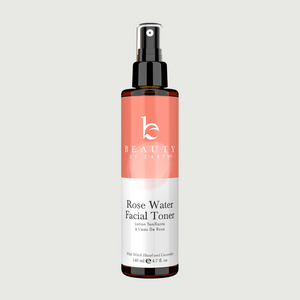 Rose Water Facial Toner bottle with pink label on a light gray background