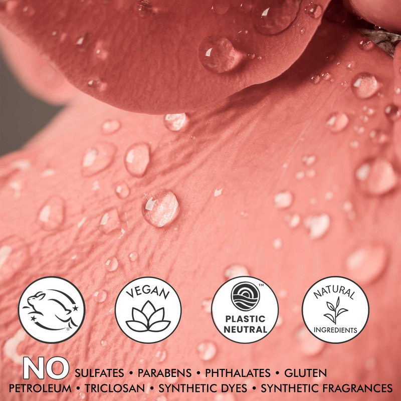 Close-up of a pink cosmetic product with water droplets and sustainability icons on a dark background.