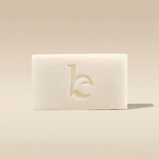 Shaving soap bar with a logo on a beige background