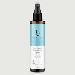 Sea Salt & Texturizing Spray bottle with blue label Ocean Waves on a light grey background