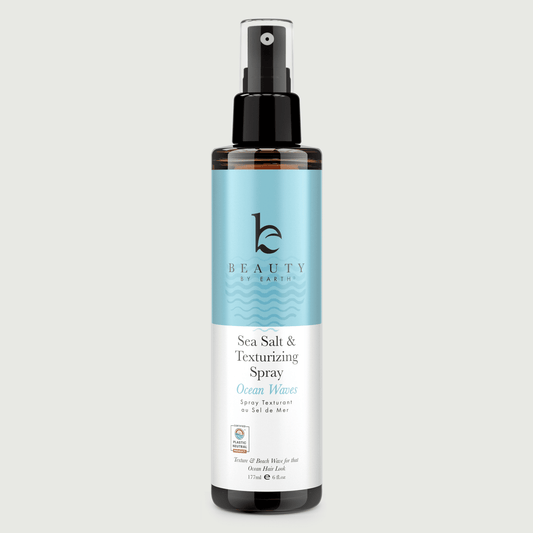 Sea Salt & Texturizing Spray bottle with blue label Ocean Waves on a light grey background