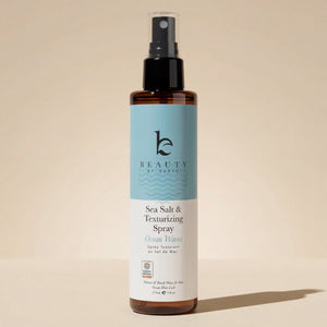 Sea Salt Spray Hair Texturizer bottle for natural volume and texture, vegan formula, on beige backdrop
