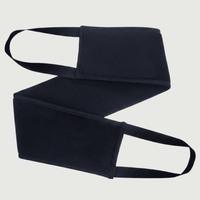 Black back applicator with a strap on a light gray background