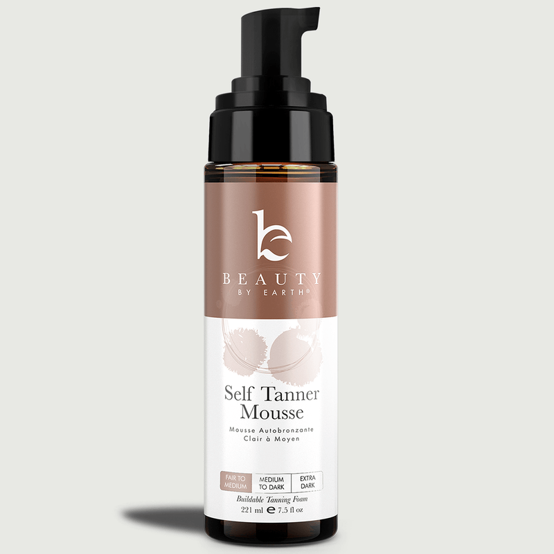 Self Tanner Mousse bottle with brand logo on a light gray background