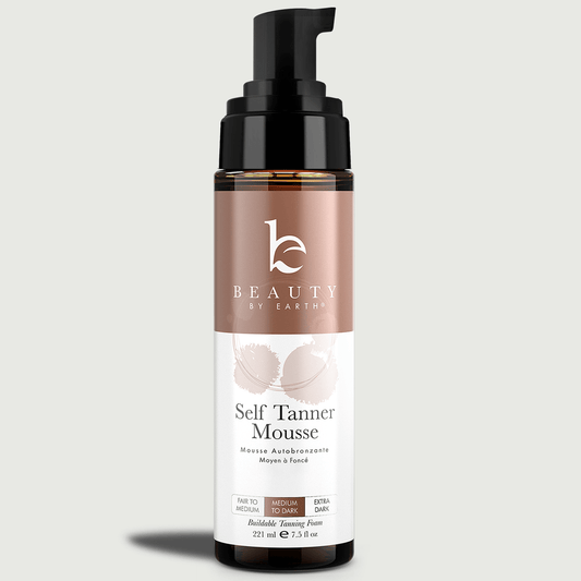 Bottle of Beauty by Earth Self Tanner Mousse on a light gray background
