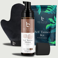 Beauty by Earth self Tanner mousse bottle, mitt, and packaging on a light gray background