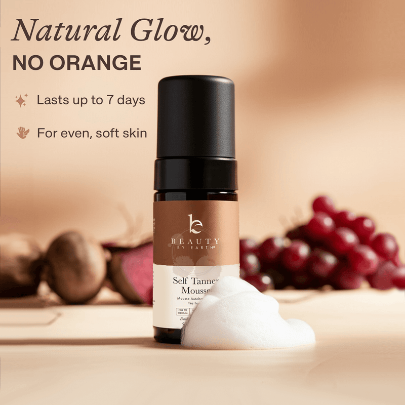 Self tanner mousse bottle with ingredients in the background
