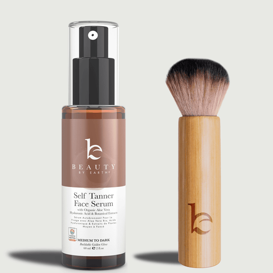Self Tanner face serum medium to dark with a kabuki facial brush on a light gray background