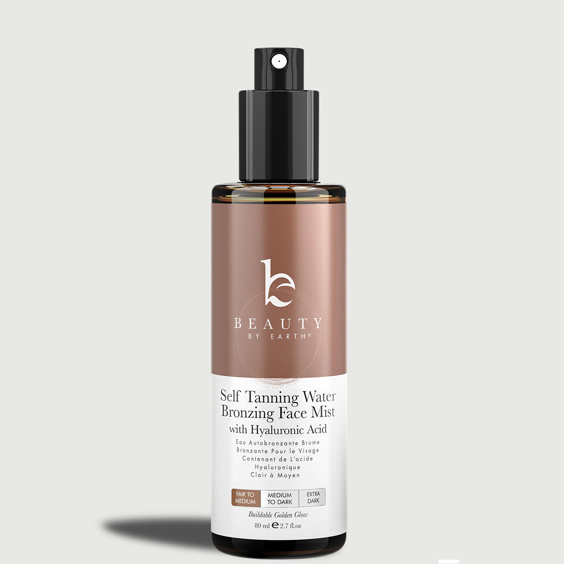 Beauty by Earth self-tanning water bronzing face mist bottle on a light gray background