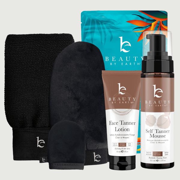 Beauty by Earth self tanning mousse and face lotion medium to dark bundle with application kit black body and face mitt, and exfoliation glove on a light gray background.