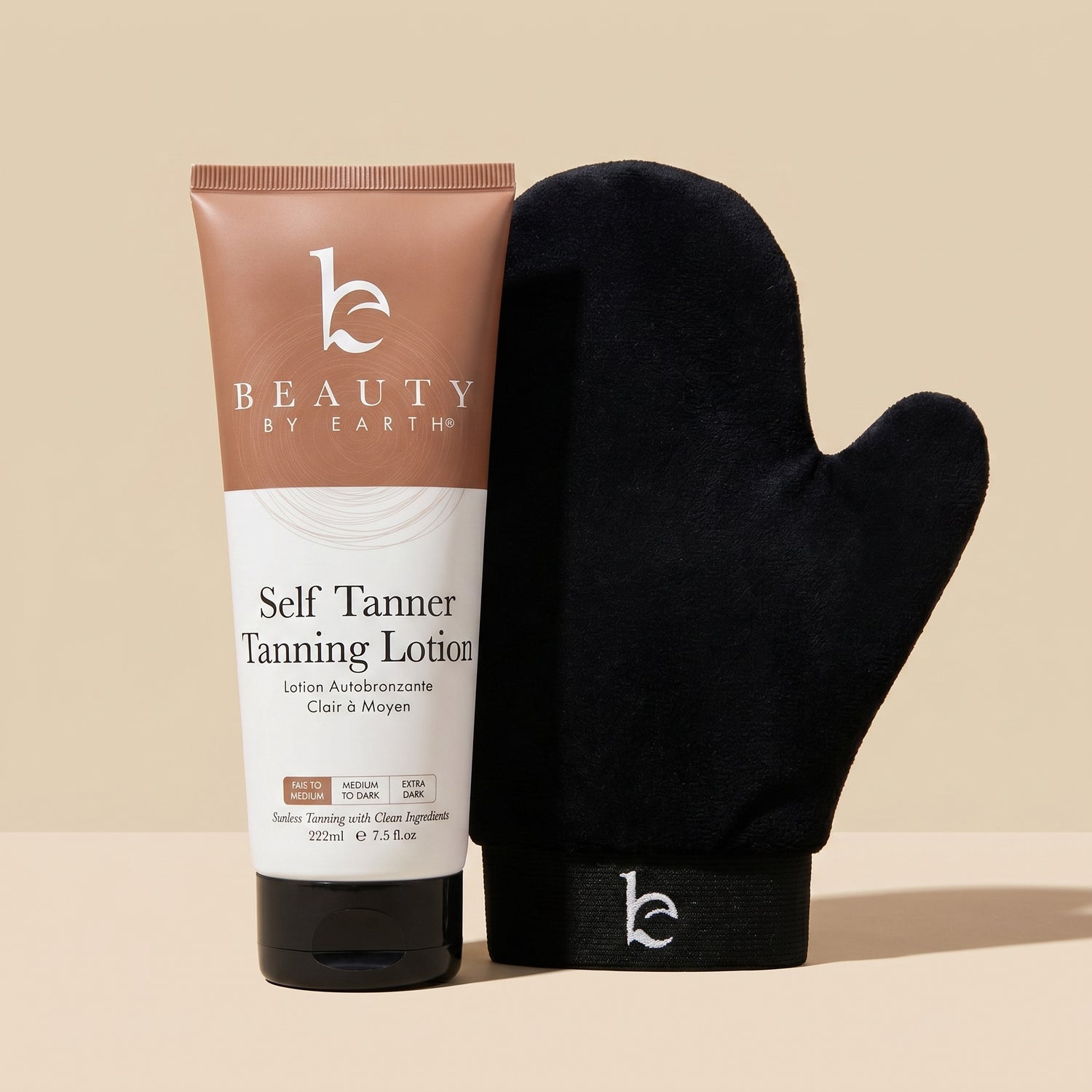 Tube of self tanner lotion with black application mitt