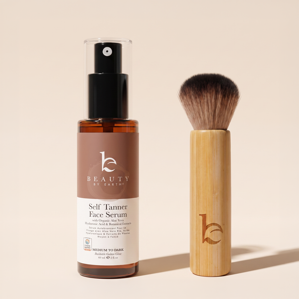 Self Tanner face serum medium to dark with a kabuki facial brush on a light gray background