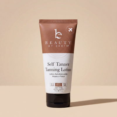 Tube of Beauty by Earth Self Tanner Tanning Lotion on a beige background