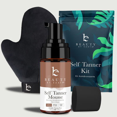 Self Tanner Mousse bottle, glove, and packaging with 'Beauty by Earth' branding on a light gray background.