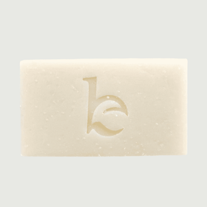 Bar of soap with a logo on a light gray background