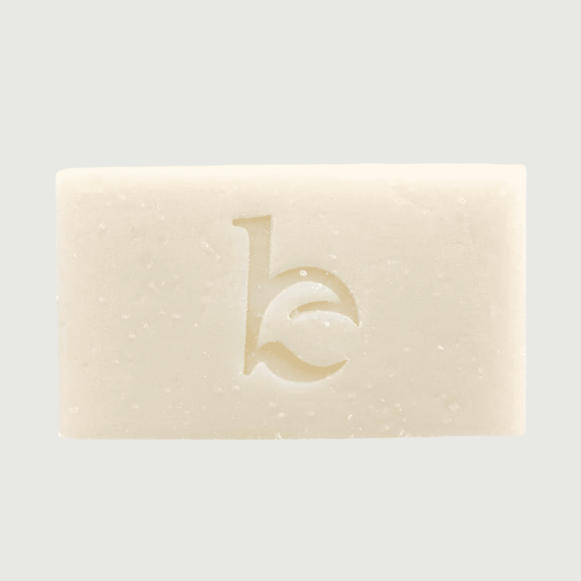 Bar of soap with a logo on a light gray background