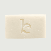 Bar of soap with a logo on a light gray background