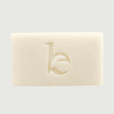 Bar of soap with a logo on a light gray background