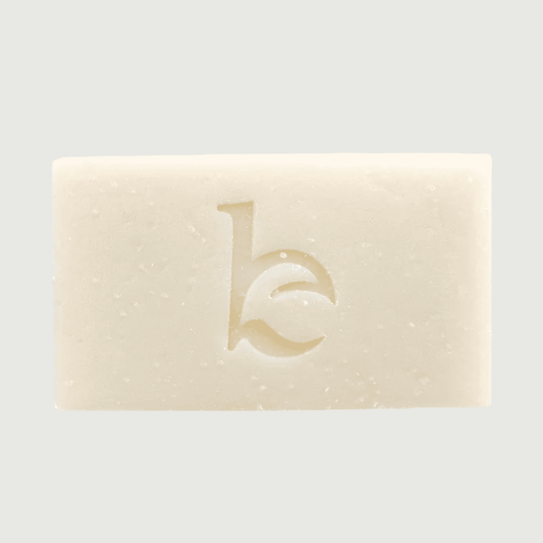 Bar of soap with a logo on a light gray background