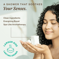 A model holding cubes of shower steamers, a shower that soothes your senses. 