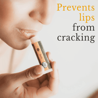 Lip balm being applied to lips with text 'Prevents lips from cracking' on a light background