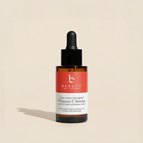 Beauty by Earth Vitamin C Serum bottle on a beige background