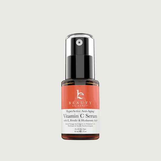Vitamin C serum bottle with a red label on a light gray background
