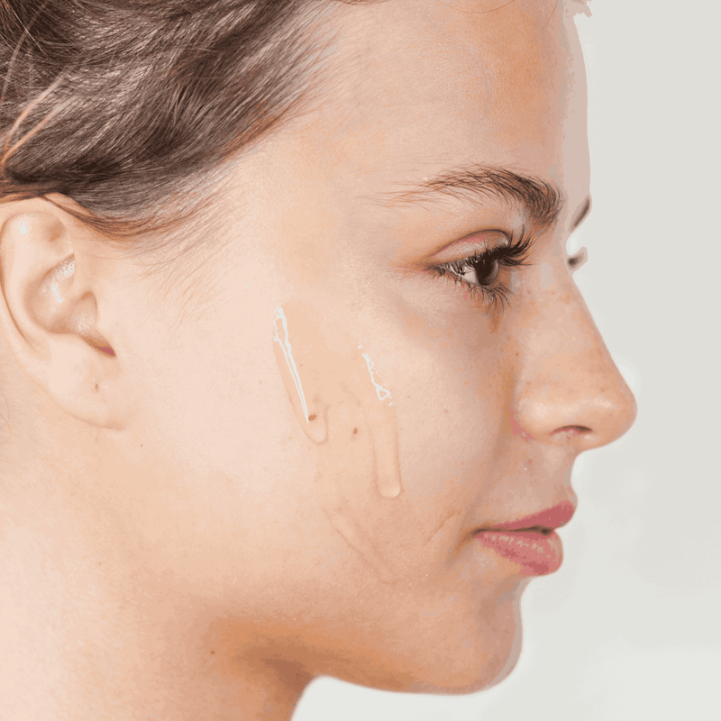 Close-up of a woman's face with a neutral background