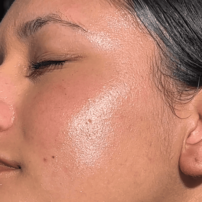 Close-up of a person's face with sun-kissed skin