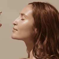 Close-up of a woman's face with a neutral background