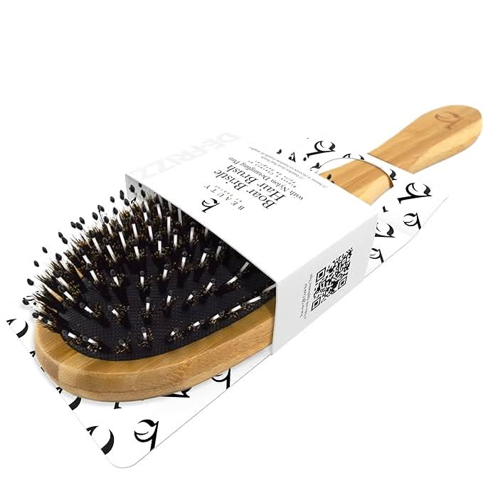 Hairbrush with wooden handle and bristles on a white background
