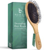 Detangling hair brush with packaging on a white background