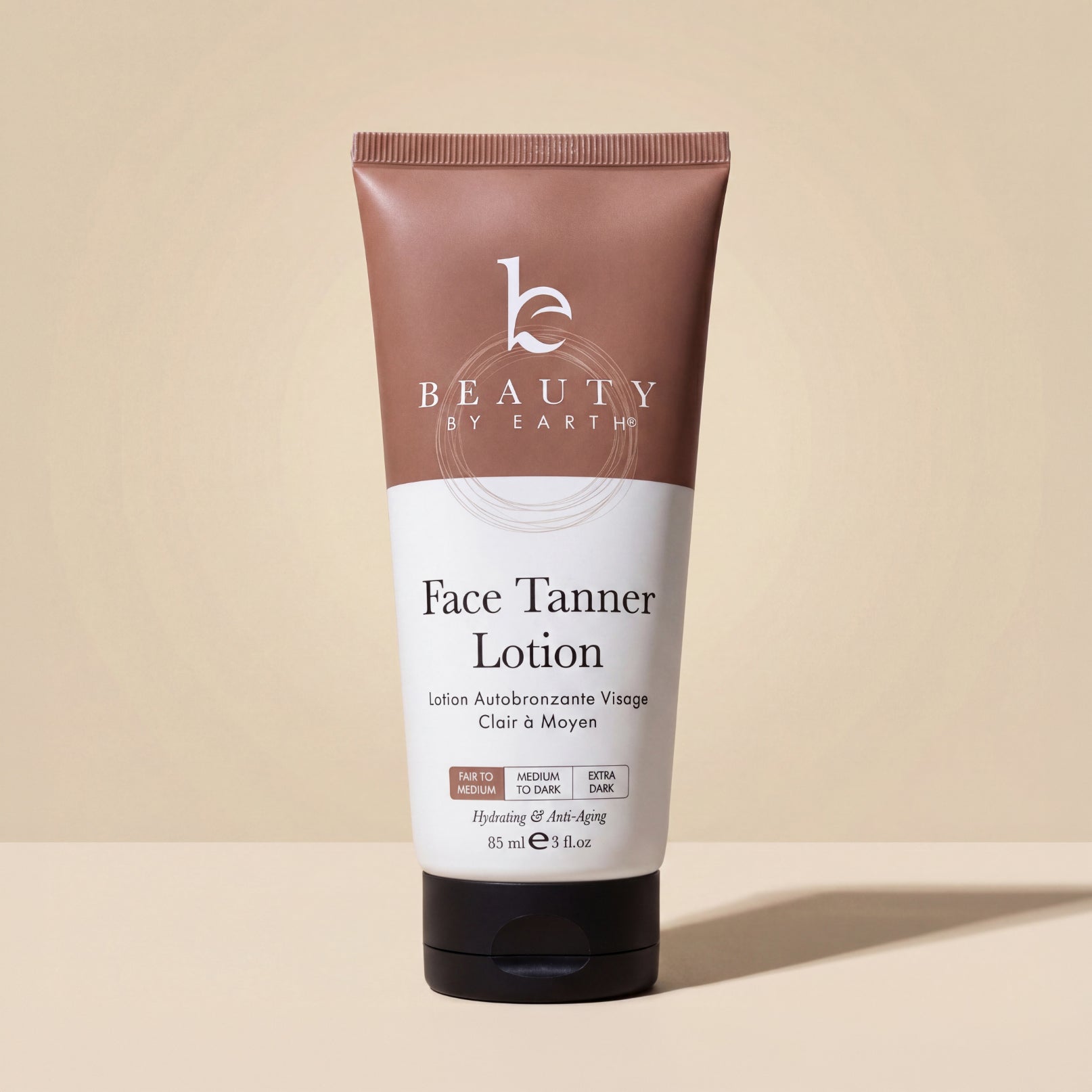 Tube of Beauty by Earth Face Tanner Lotion on a beige background