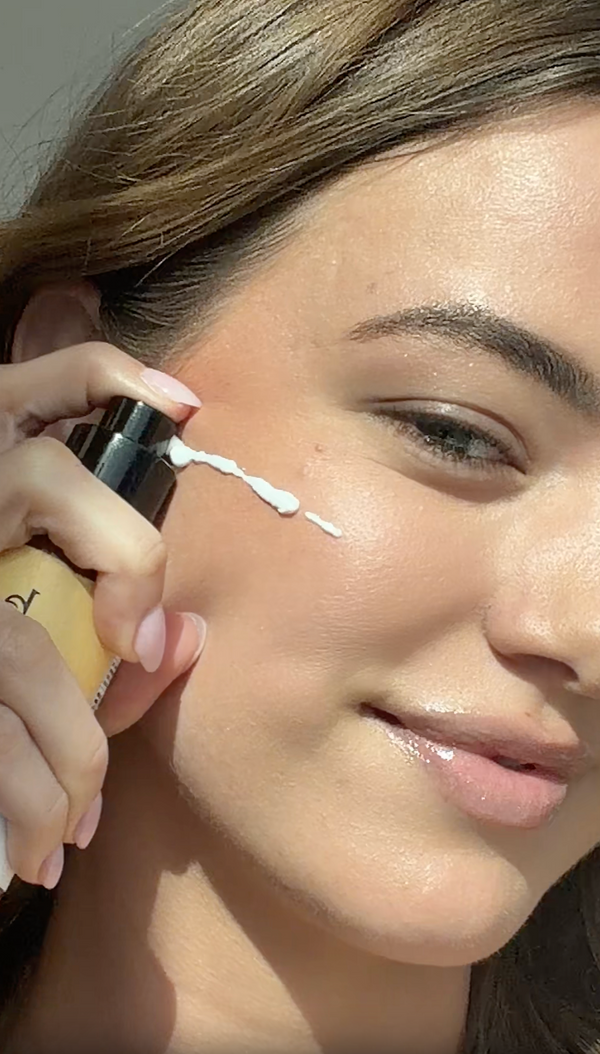 Sage applys SPF face serum - product demo