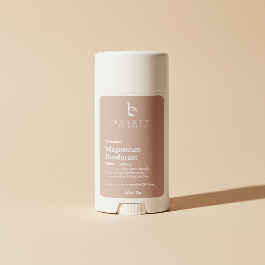 Deodorant stick with 'Beauty by Earth' branding on a beige background